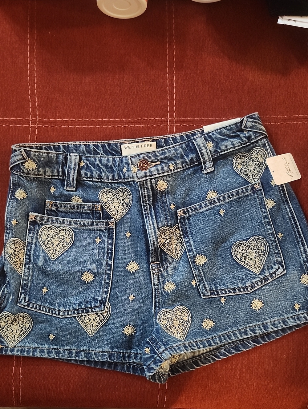 We The Free Blue Denim Shorts with Cream Embroidered Hearts